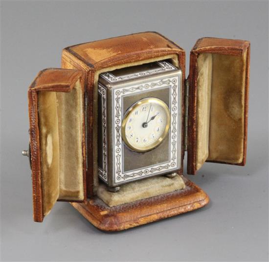 An early 20th century continental silver and enamel miniature carriage timepiece, with leather carrying case, 2in.